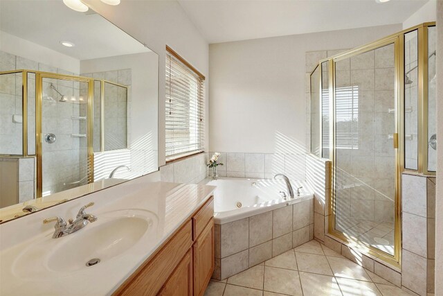2802 Truman Cv, Lago Vista, TX 78645 - bathroom with a jetted tub, vanity, tile patterned flooring, and a shower stall