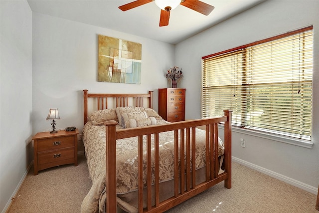 2802 Truman Cv, Lago Vista, TX 78645 - carpeted bedroom with baseboards and a ceiling fan