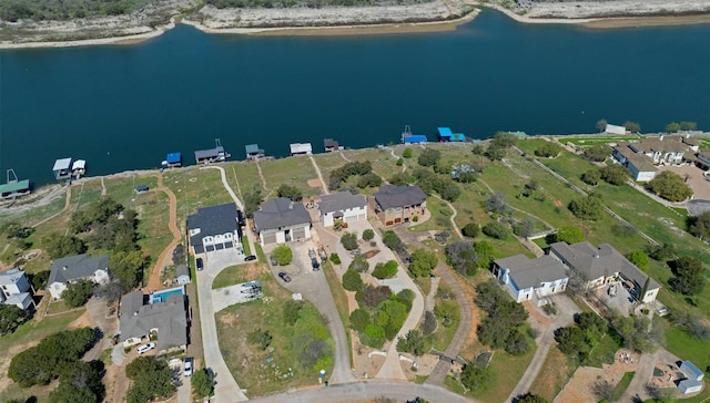 birds eye view of property featuring a residential view and a water view