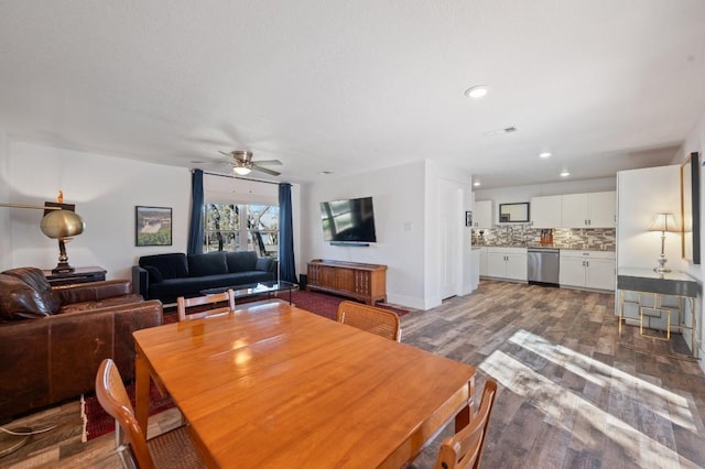 dining space featuring ceiling fan, wood finished floors, and recessed lighting