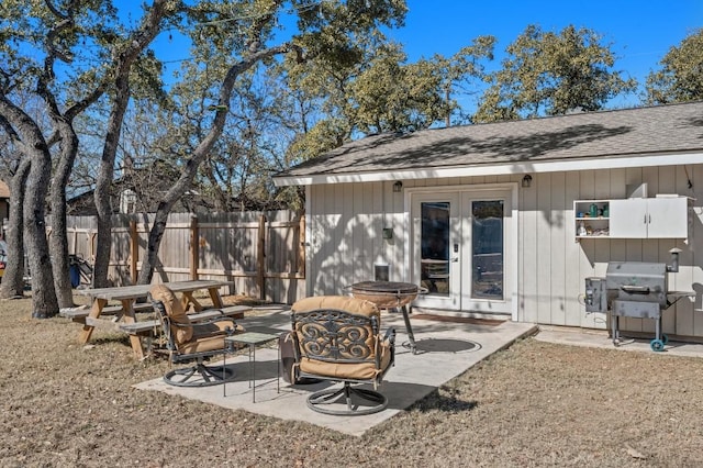 view of patio / terrace featuring french doors, fence, and area for grilling