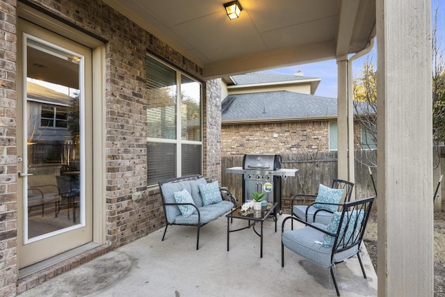 view of patio / terrace featuring a grill and fence