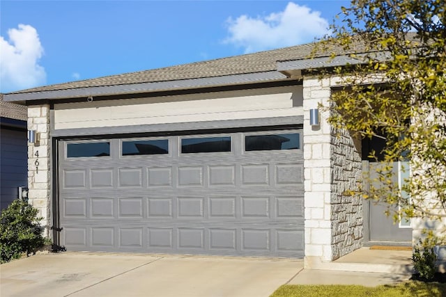 garage featuring driveway