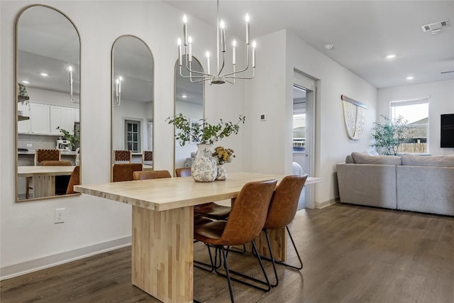 dining area featuring baseboards, visible vents, dark wood-style flooring, a notable chandelier, and recessed lighting