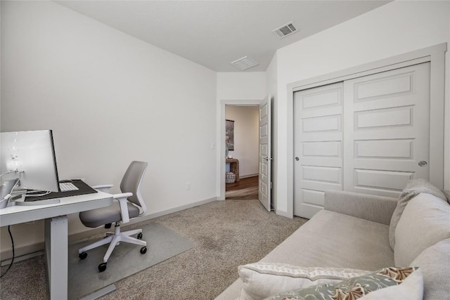 office area with carpet, visible vents, and baseboards