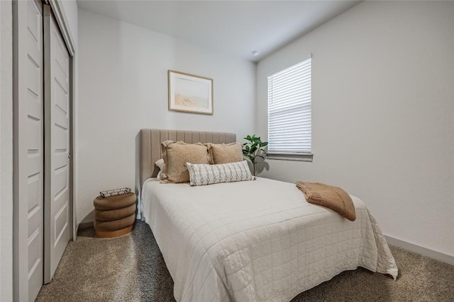 bedroom featuring carpet flooring and baseboards