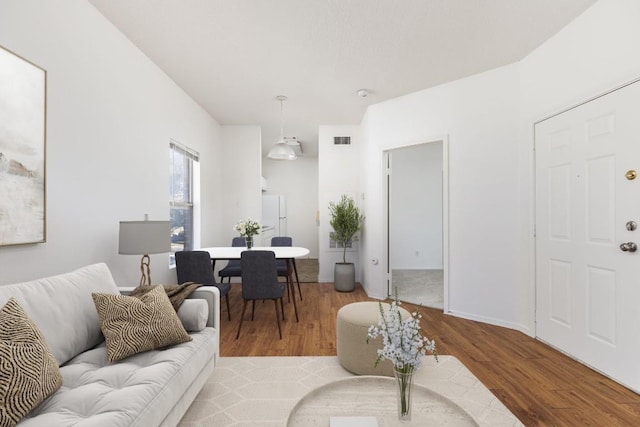 12166 Metric Blvd Unit 230, Austin, TX 78758 - living area featuring wood finished floors