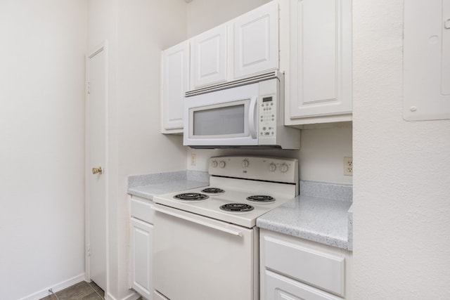 12166 Metric Blvd Unit 230, Austin, TX 78758 - kitchen with white appliances, light countertops, white cabinetry, and electric panel