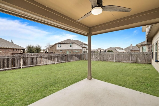 view of yard featuring a residential view, a patio area, a fenced backyard, and ceiling fan