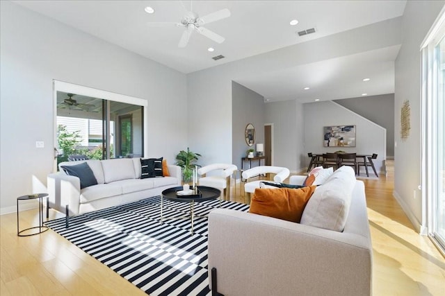 living area featuring recessed lighting, visible vents, and light wood-style flooring