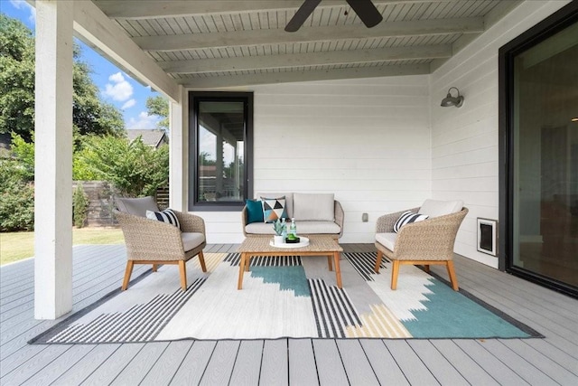 wooden deck featuring a ceiling fan and an outdoor hangout area