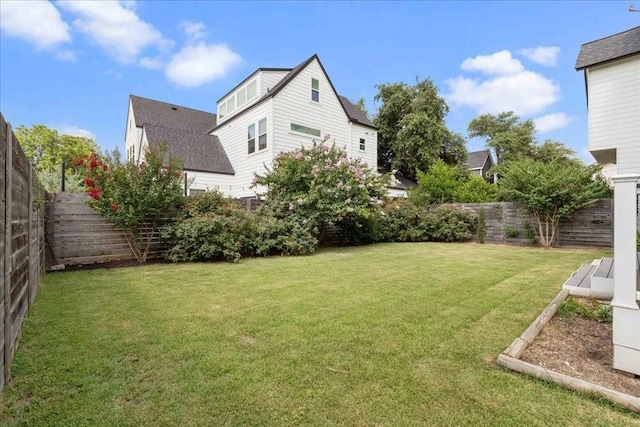 view of yard featuring a fenced backyard