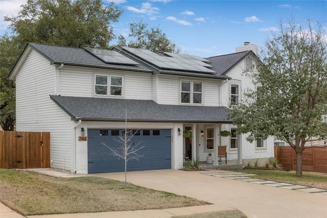 view of front of house featuring roof with shingles, a chimney, an attached garage, fence, and driveway