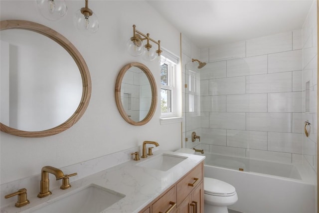 bathroom with  shower combination, double vanity, a sink, and toilet