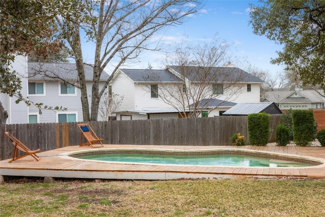 view of pool with a fenced backyard and a fenced in pool