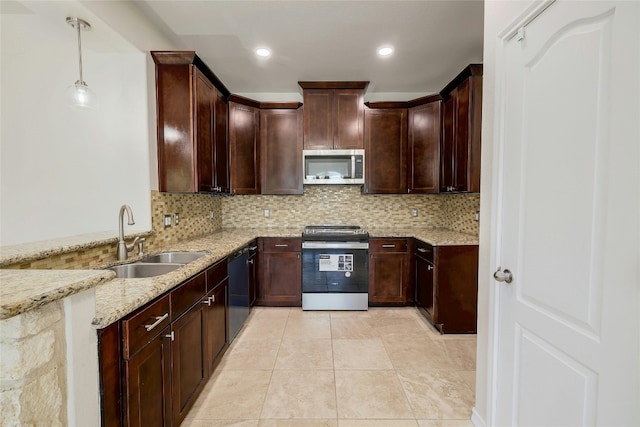 kitchen featuring decorative backsplash, light stone counters, stainless steel appliances, a sink, and light tile patterned flooring