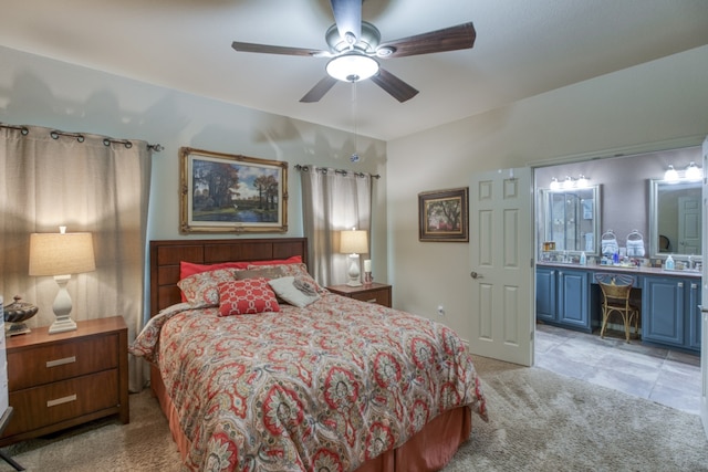 bedroom with a ceiling fan and light colored carpet