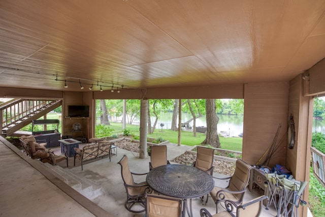 view of patio / terrace featuring stairway and outdoor dining area