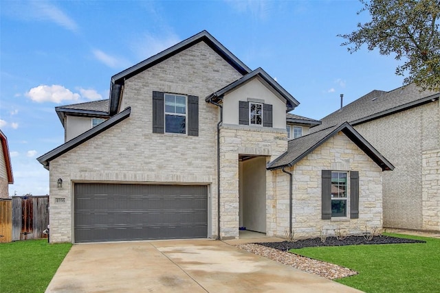 view of front of property featuring a garage, concrete driveway, a front yard, and fence