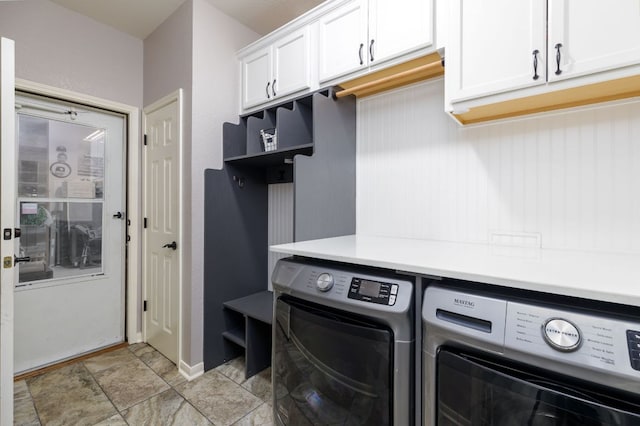 laundry room with cabinet space and washing machine and clothes dryer