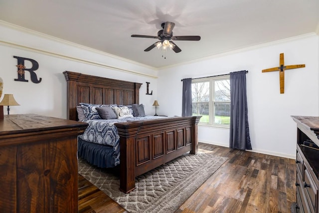 bedroom with dark wood-style flooring, crown molding, and baseboards