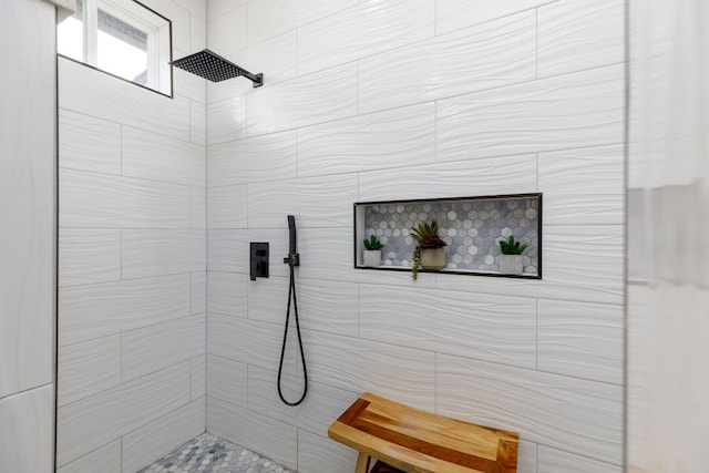 bathroom with tiled shower