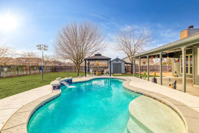 view of swimming pool featuring a patio area, a yard, a fenced backyard, and a gazebo