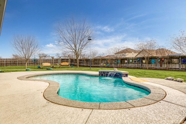 view of swimming pool featuring a fenced in pool, a patio area, a fenced backyard, and a yard