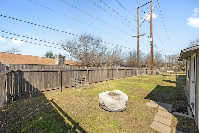 view of yard featuring a fenced backyard