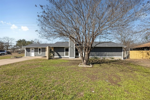 view of front of house with fence and a front yard