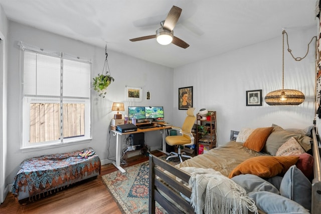 bedroom with ceiling fan and wood finished floors