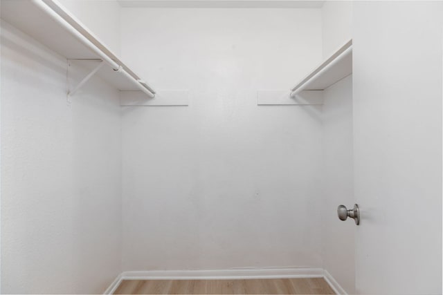 spacious closet with light wood finished floors