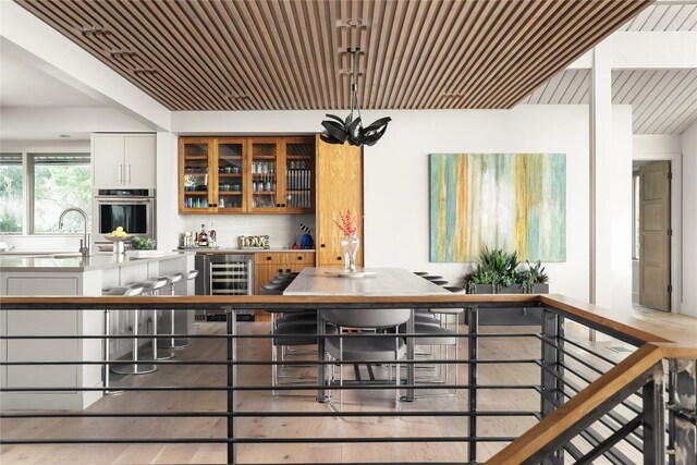 719 Cutlass St, Austin, TX 78734 - bar with oven, beverage cooler, and wood ceiling