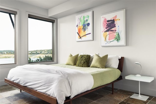 719 Cutlass St, Austin, TX 78734 - bedroom with stone tile floors and multiple windows
