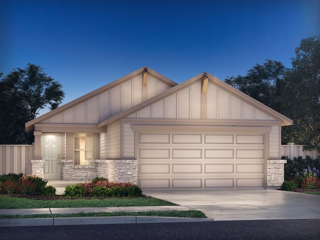 craftsman house with stone siding, board and batten siding, concrete driveway, and fence