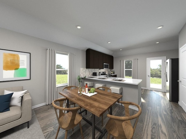 dining space with plenty of natural light, baseboards, dark wood-style flooring, and recessed lighting