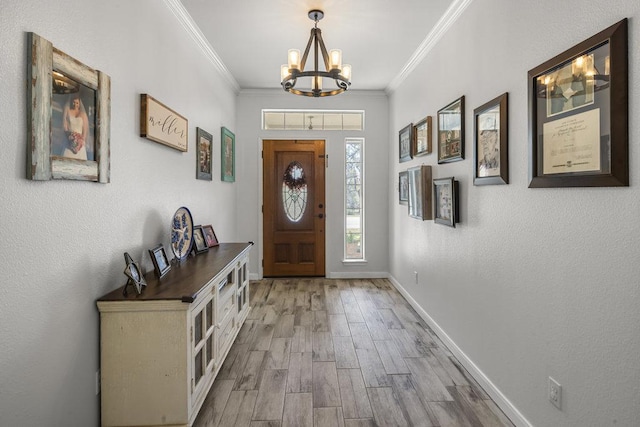 foyer featuring baseboards, a notable chandelier, wood finished floors, and crown molding