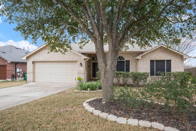 single story home with brick siding, concrete driveway, an attached garage, and a shingled roof