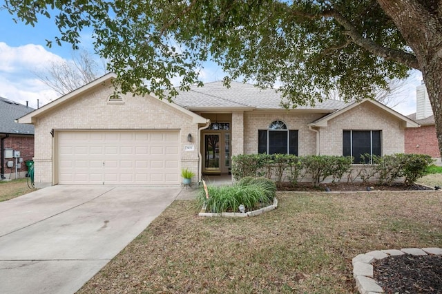 ranch-style house featuring a front lawn, driveway, a shingled roof, a garage, and brick siding