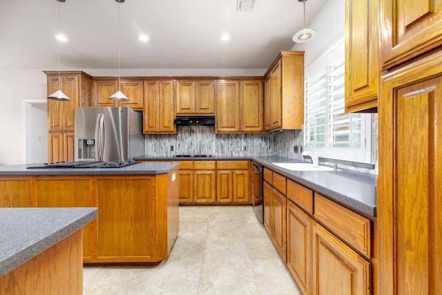 kitchen featuring extractor fan, gas cooktop, a sink, stainless steel refrigerator with ice dispenser, and dishwasher