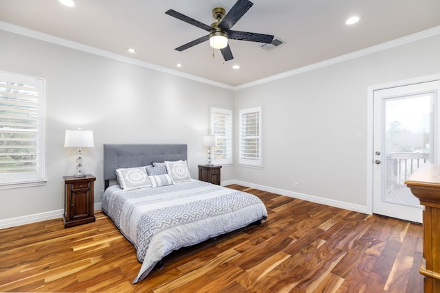 bedroom featuring baseboards, visible vents, and wood finished floors