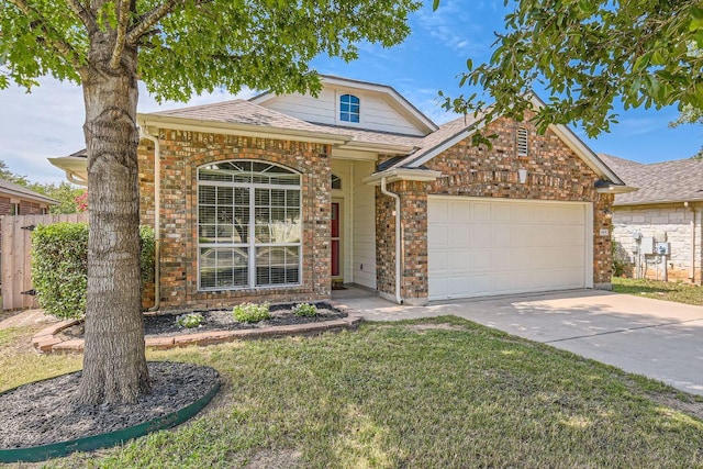 traditional home featuring a shingled roof, fence, concrete driveway, a front yard, and a garage