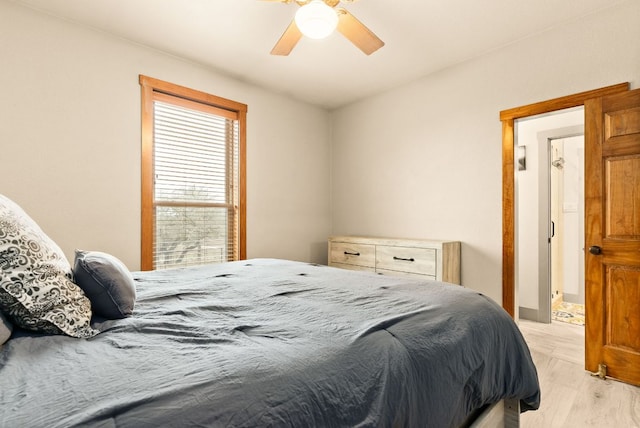 bedroom with light wood finished floors and a ceiling fan