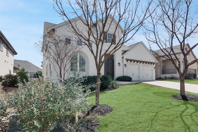 4104 Belisario Ct, Leander, TX 78641 - view of front of property with stucco siding, driveway, a front yard, and an attached garage