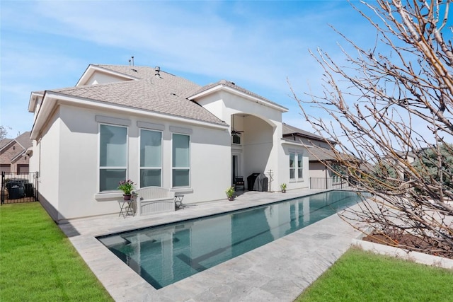 4104 Belisario Ct, Leander, TX 78641 - back of property featuring a patio, stucco siding, and a shingled roof