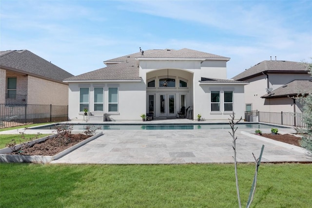 4104 Belisario Ct, Leander, TX 78641 - back of house with a patio, stucco siding, french doors, and roof with shingles