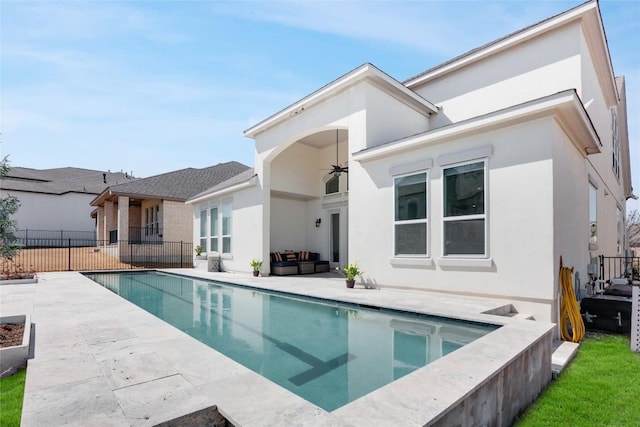 4104 Belisario Ct, Leander, TX 78641 - rear view of property featuring stucco siding, an outdoor hangout area, a ceiling fan, and a patio