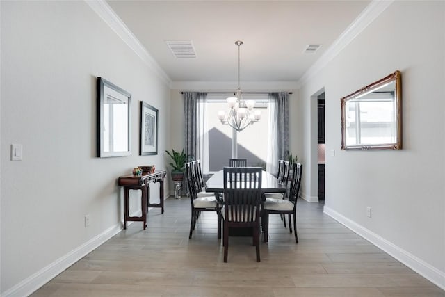 4104 Belisario Ct, Leander, TX 78641 - dining room with a chandelier, crown molding, plenty of natural light, and light wood-type flooring