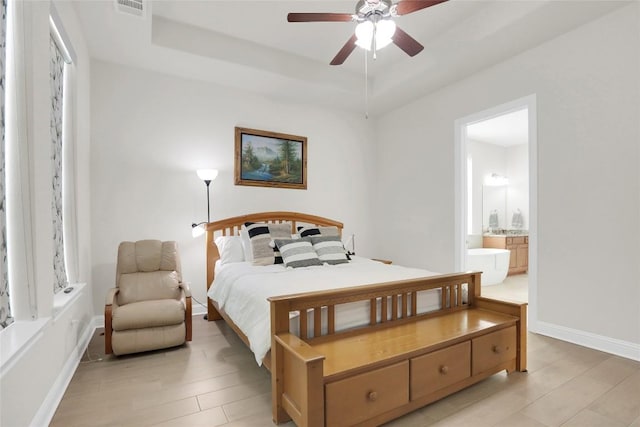 4104 Belisario Ct, Leander, TX 78641 - bedroom with ensuite bathroom, a raised ceiling, and ceiling fan
