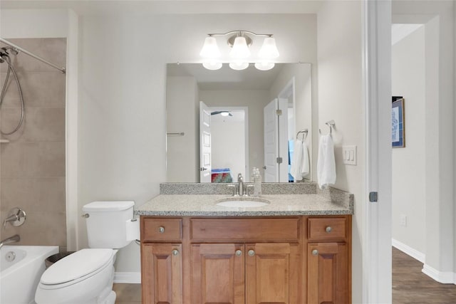 4104 Belisario Ct, Leander, TX 78641 - full bath with vanity, washtub / shower combination, and wood finished floors